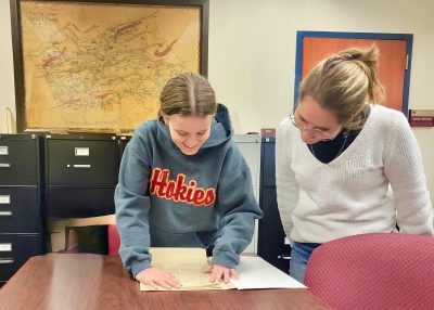 students Grace Vaughan Sacks and Grace Kostrzebski researching for the project at Kegley Library in Wytheville. 