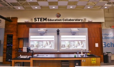 STEM Lab, front of the classroom, projectors, and instructior station