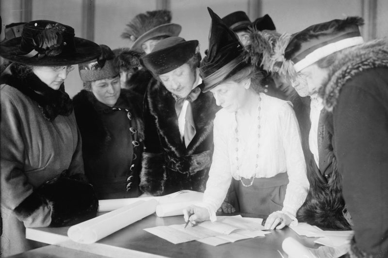 Suffragist Bertha M. Furman (center), who worked for the League of Women Voters, teaches women how to vote. Photo, taken circa 1915, courtesy of the George Grantham Bain Collection/Library of Congress.
