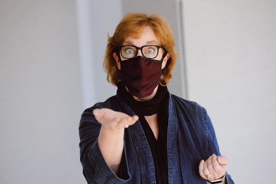 Patty Raun, a professor in the School of Performing Arts at Virginia Tech and director of the Center for Communicating Science, demonstrates ways to communicate behind a face mask. 