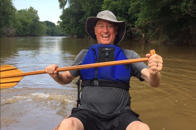 Gary Downey paddles a canoe