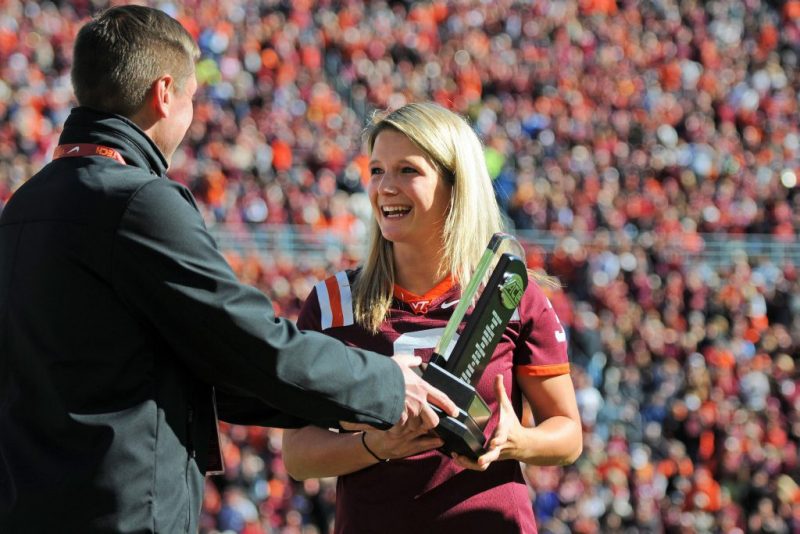 Irena Gillarova, seen here being recognized with her teammates after the Hokies won the ACC track and field team title in 2015, won two national championships in her career and now is hoping to earn an Olympic medal in Tokyo. 