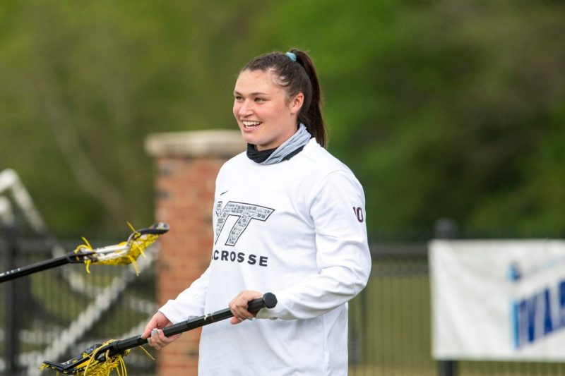 Mary Griffin holding a lacrosse stick