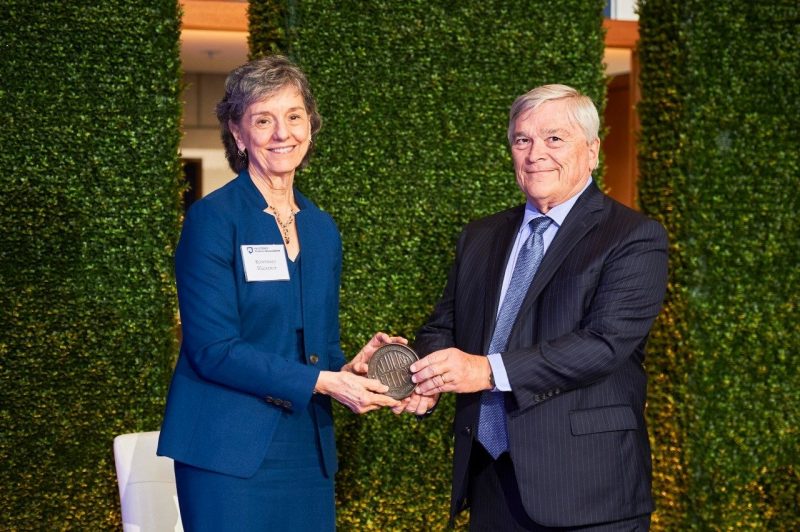 Rosemary Blieszner receives Alumni Fellow Award from Penn State president Eric J. Barron. 