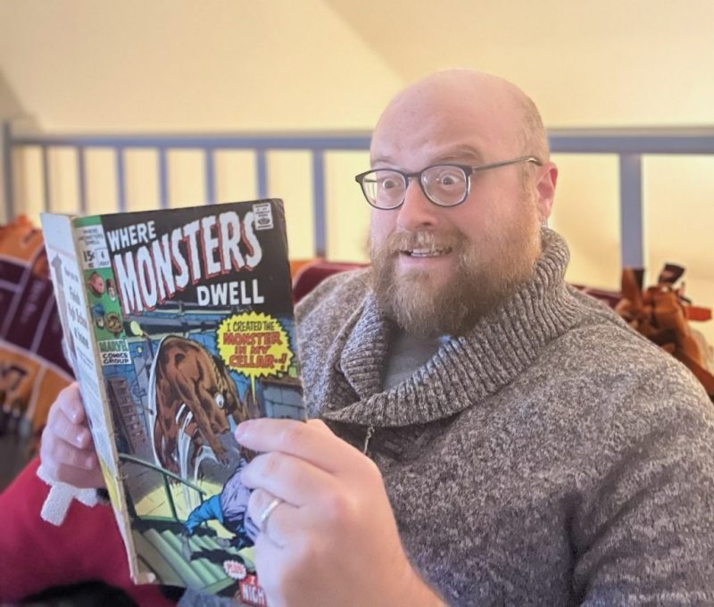 Shaun Baker, Department of English, reads a horror comic book