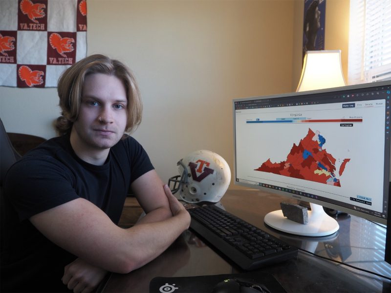 Sitting at his desk, with an electoral map pulled up on his computer screen, Chaz Nuttycombe looks at the camera.