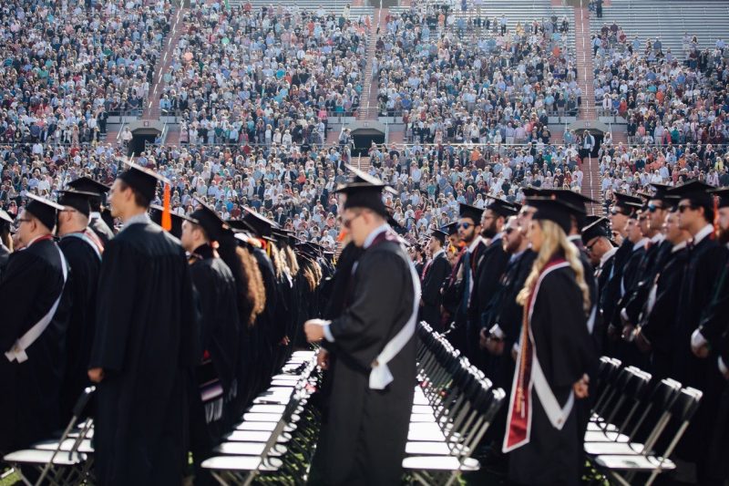 Graduates, friends, and families attend commencement ceremonies in Lane Stadium. 