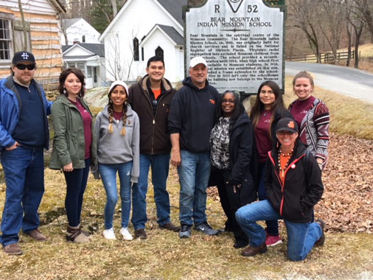 Virginia Tech students and faculty leaders visited the Monacan Nation in Amherst County recently to share information about the university experience with tribal youth. Pictured from left to right are Sam Cook, director of American Indian Studies; Melissa Faircloth, advisor of Native at VT; Lucia Chambi; Jason Chavez; Monacan Nation Chief Dean Branham; Menah Pratt-Clarke, vice provost for inclusion and diversity; Nizhoni Tallas; Qualla Ketchum; and Mae Hey, indigenous community liaison.