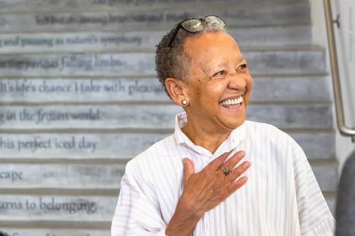 Internationally renowned poet Nikki Giovanni stands in front of 22 Steps, on ongoing Moss Arts Center installation that presents poetry as a spatial and visual experience unleashed from the confines of the printed page.