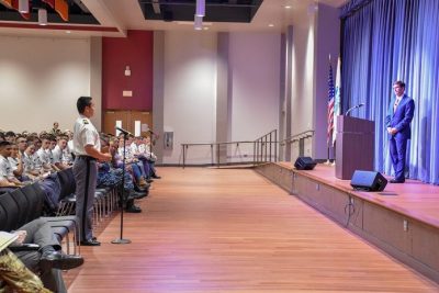 Cadet Matt Krusiac, at left, a senior majoring in history, asks Secretary of the U.S. Army Mark T. Esper a question during a town hall-style meeting with the Virginia Tech Corps of Cadets.
