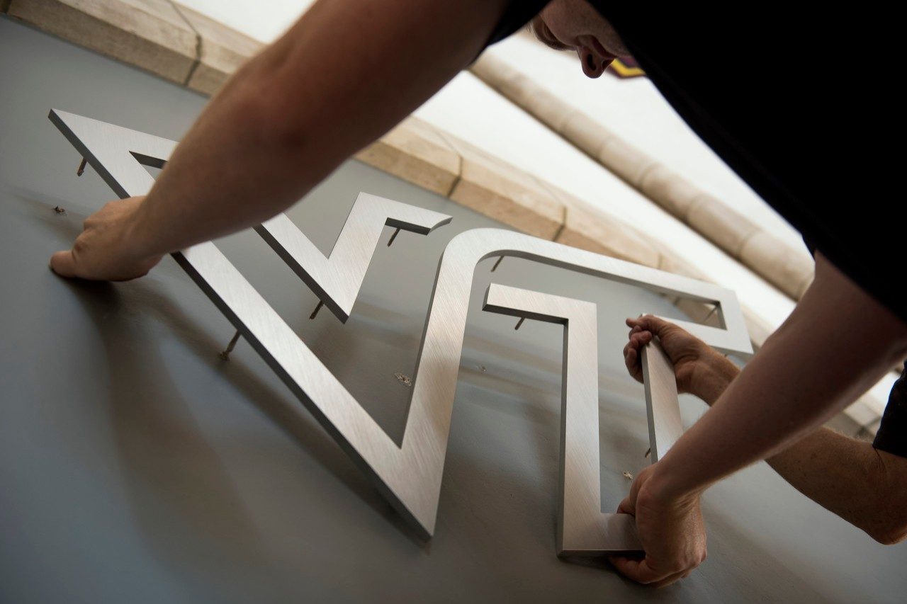 Virginia Tech logo is installed in Burruss Hall