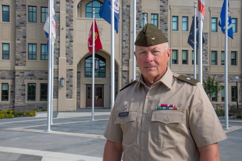 Edwards in his Army uniform in front of the Corps Leadership and Military Science Building.