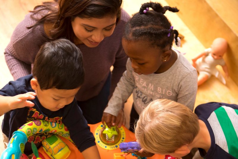 A student works with children in the Child Development Center for Learning and Research