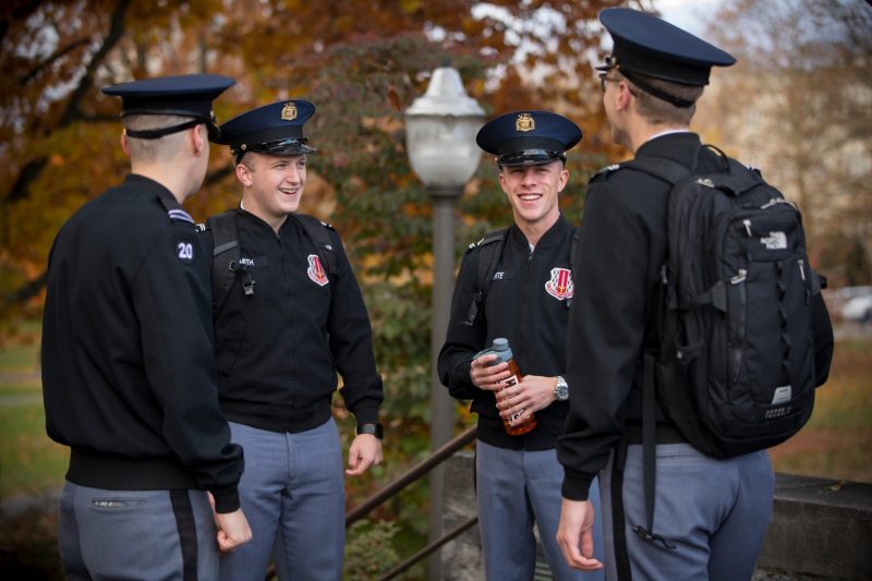 Group of four male cadets in casual conversion