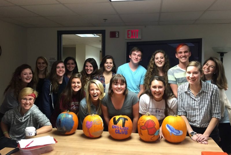 Sigma Tau Delta students posed with painted pumpkins