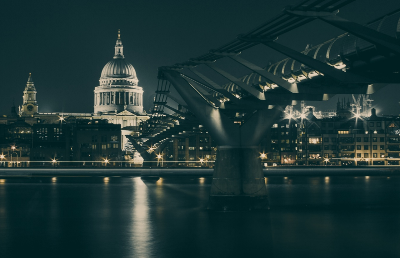 Photo of capital buildings along a river at night