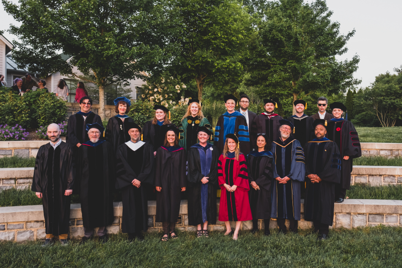 a group of professors in commencement regalia