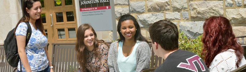 a racially mixed group of students study together