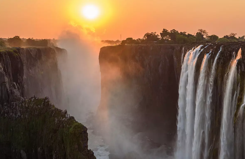 an aerial view of victoria falls at sunset