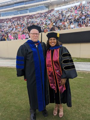 Dr. Marcus Weaver-Hightower and a doctoral gradaute