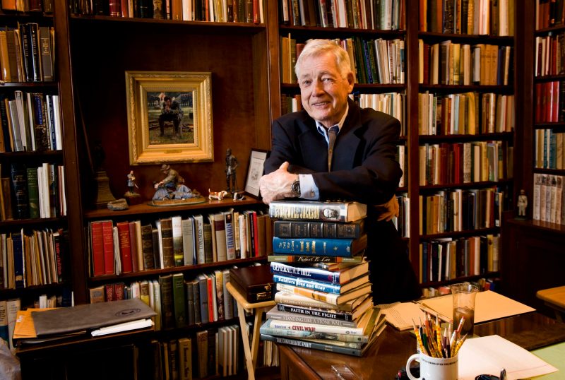 James "Bud" Robertson in his home study with a few of his published works.