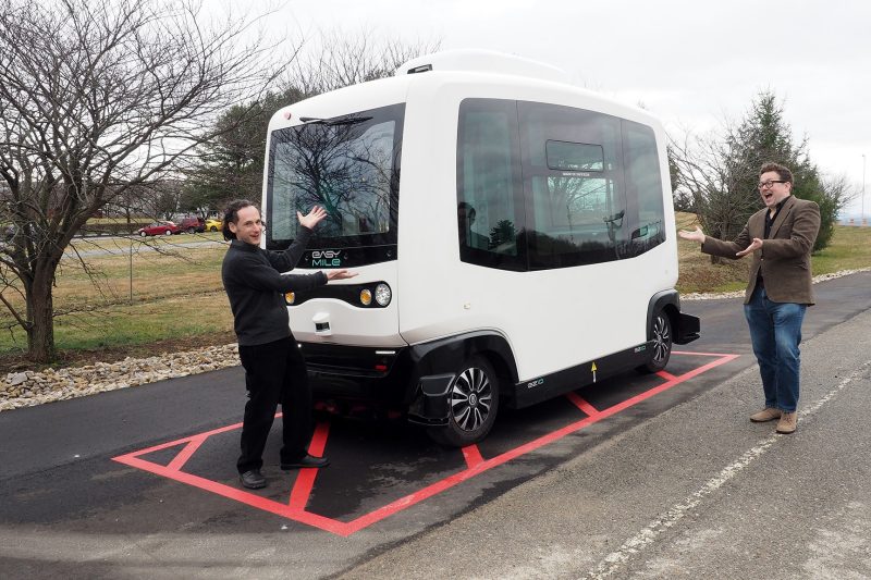Saul Halfon (left) and Lee Vinsel playfully consider a low-speed autonomous shuttle undergoing testing at the Virginia Tech Transportation Institute. Halfon, an associate professor at Virginia Tech, explores public engagement with science and technology, while Vinsel, an assistant professor, studies the intersection of technology and humanity.