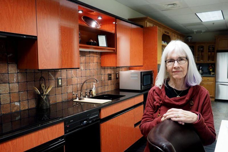 Kathleen Parrott stands in a kitchen