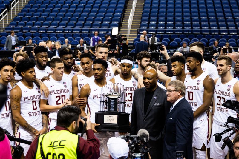 Liam Sment photographed the handing of the trophy to Florida State University players.