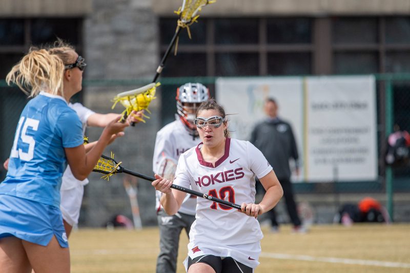 Virginia Tech lacrosse player Mary Griffin making a move against North Carolina