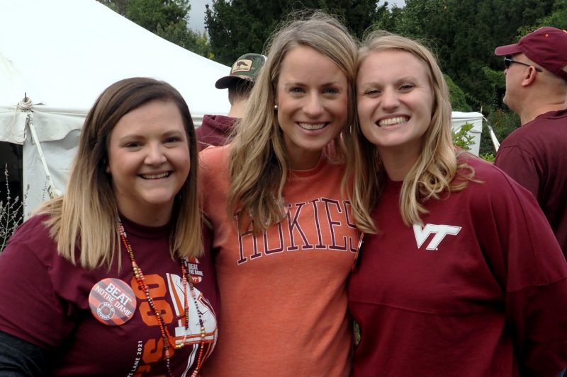 Meghan Jester (center), assistant dean in the College of Liberal Arts and Human Sciences, catches up with friends.