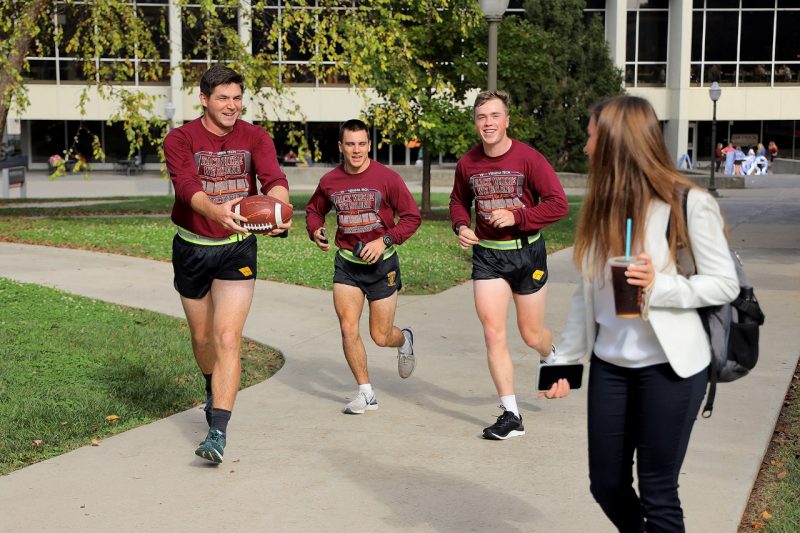 From left, Ryan Kros, William Crandall, and Jeffrey Jensen, all cadets in the Army ROTC Ranger Company, ran one of the homecoming game balls around campus this week, encouraging people to touch it for good luck for the Hokies in Saturday’s football game. 