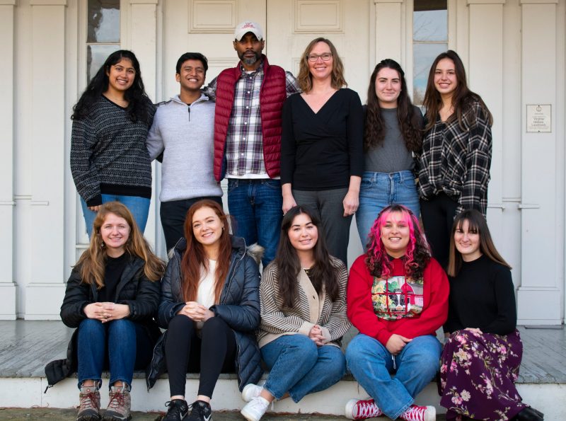 Members of the Appalachian Community Research class join professor Emily Satterwhite (back row center) on the porch of the historic home Solitude. 