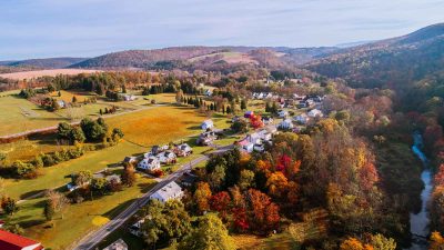 colorful trees in a rural setting; the image was taken by a drone over the appalachian mountains
