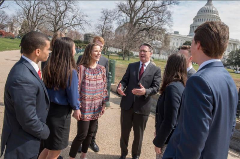 Photo of President Tim Sands meeting and talking with students