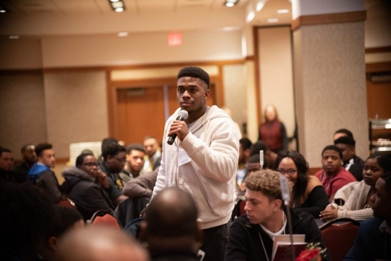 A student takes the floor at the 2019 Uplifting Black Men Conference. 