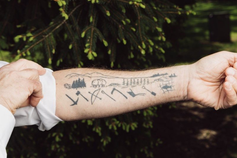 Photo of John Provo's tattoo of the economic development theory known as the Valley Section. Photo by Christina Franusich for Virginia Tech.