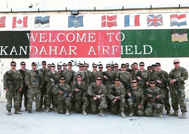 Jeff Parks is photographed posing with his platoon at Kandahar Airfield in Afghanistan.