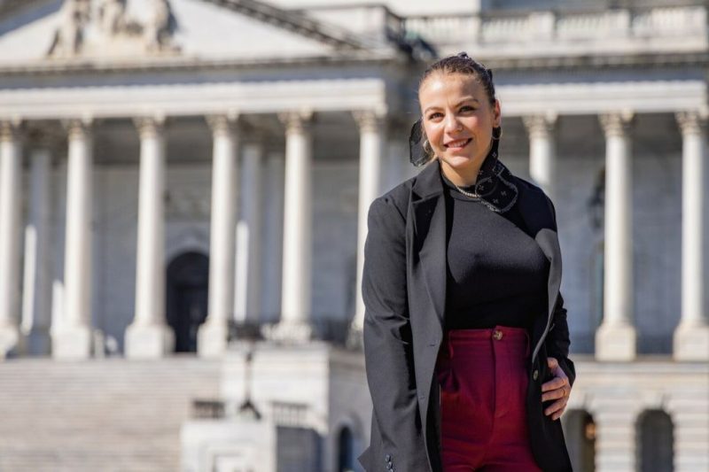 Photo of Christa Potgieter, a junor majoring in political science, standing in front of the U.S. Capitol