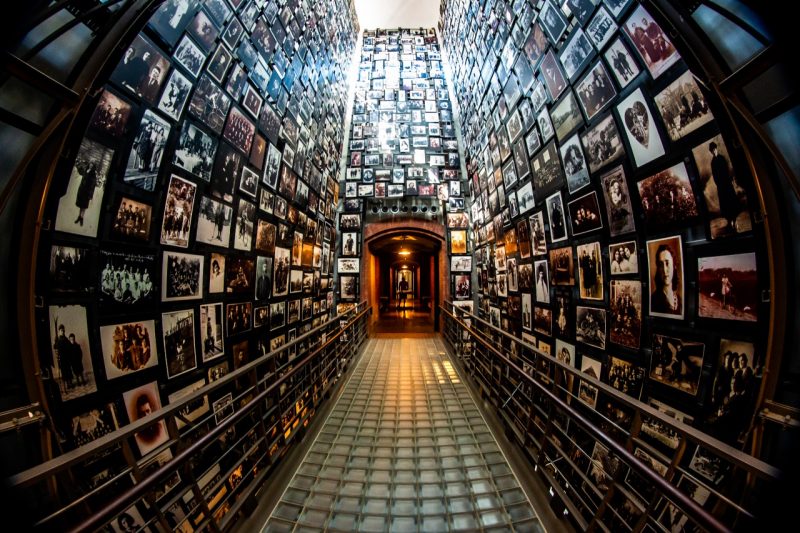 Framed photos line the walls of a hallway in the  United States Holocaust Memorial Museum.