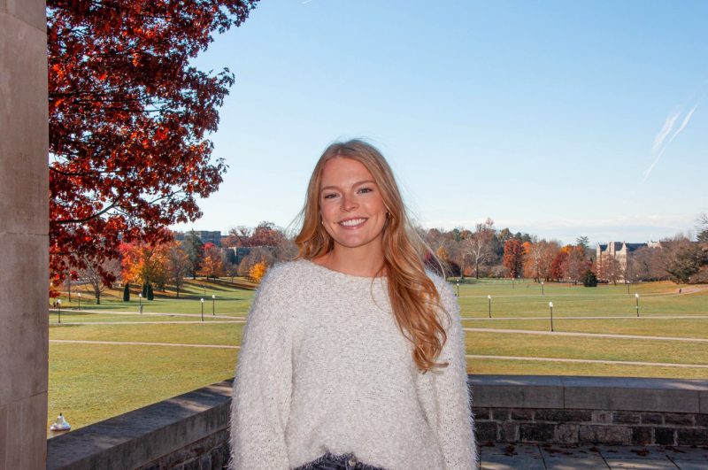 Taylor Covington with her back to the vast greenway that is the Virginia Tech Drillfield