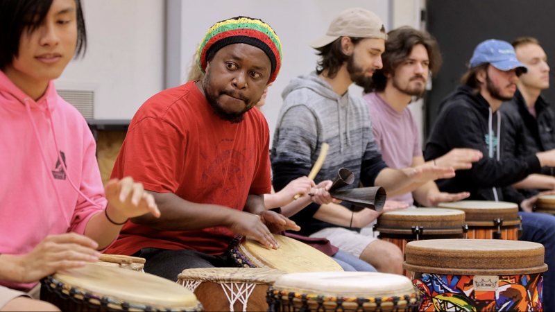 Ghana native Otu Kojo plays the drums with members of the Virginia Tech Percussion Ensemble.