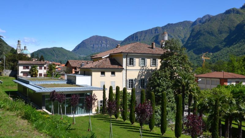 A landscape shot of the Steger Center in Riva san Vitale set in the mountains of Switzerland 