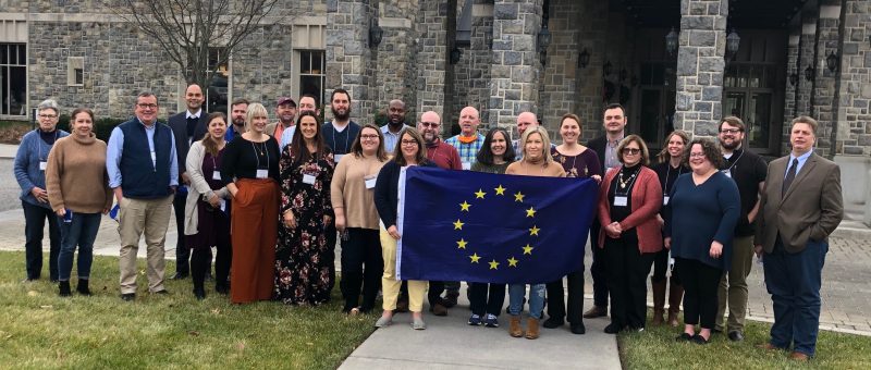 Group of Educators with EU Flag at Educators Conference