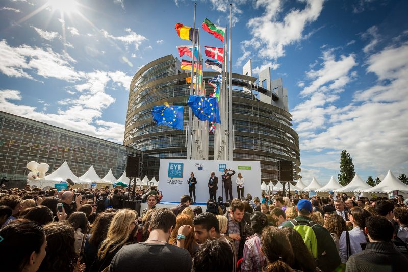 EU Parliament building with crowd