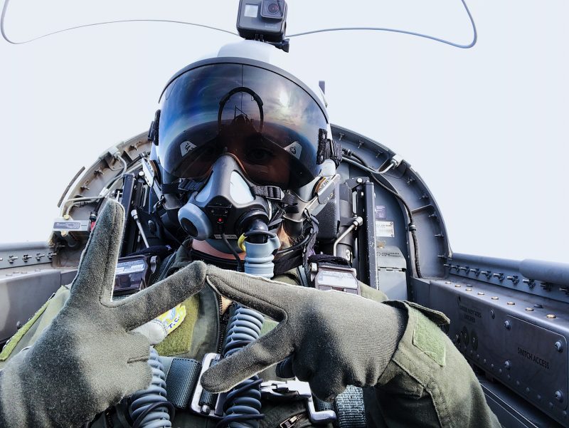 Air Force pilot in cockpit creating VT with hands