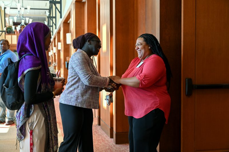 Students being greeted by faculty