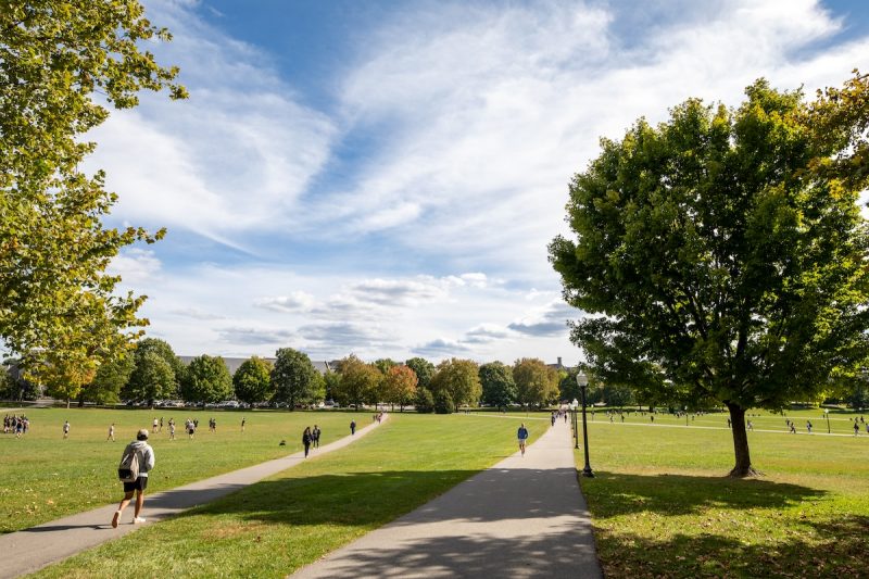 Hokies walk across the Drillfield on a fall afternoon. 